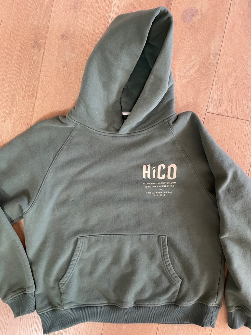 CoffeeShop Olive Green Pullover Hoodie with Cream Hibiscus Graphic